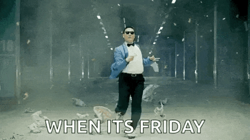 a man in a suit and bow tie is dancing in a tunnel with the words `` when it 's friday '' behind him .