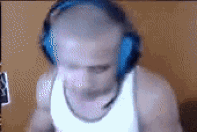 a blurry picture of a man wearing headphones and a microphone