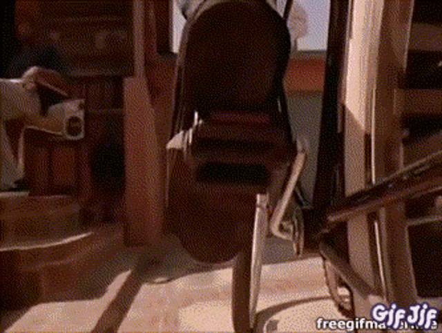 a gif of a person walking down stairs with the words freegifma.com written on the bottom