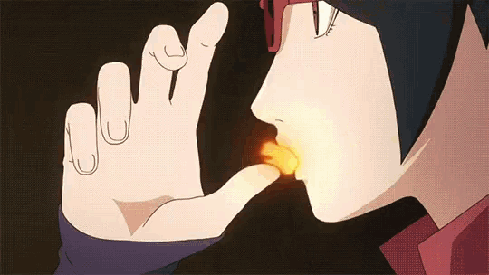 a close up of a person holding a fireball in their hand .