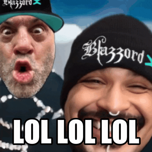 two men are posing for a picture and one of them is wearing a hat that says blazzard