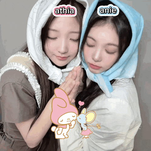 two girls wearing scarves with the names athia and anie written on them