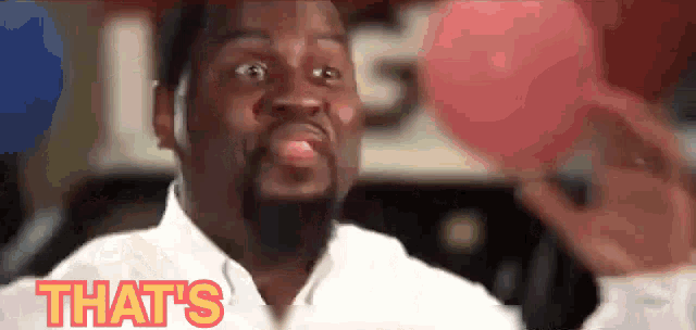 a man with a beard is making a funny face and the word that 's is on the screen