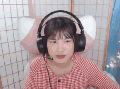 a girl wearing headphones with a microphone on her head