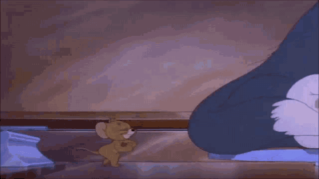 a cartoon of a mouse standing next to a cat 's paw