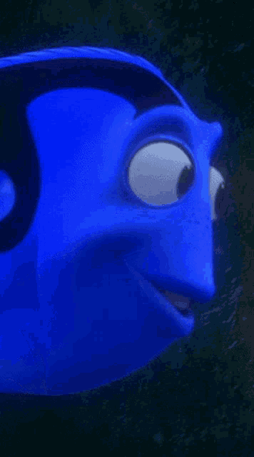 a close up of a blue cartoon fish with a yellow tail