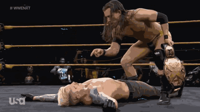 two wrestlers in a wrestling ring with us a written on the bottom