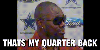 a man wearing sunglasses and a red jacket says that 's my quarterback