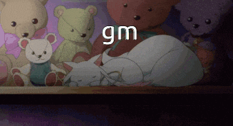 a bunch of stuffed animals are laying on a table and the word gm is above them
