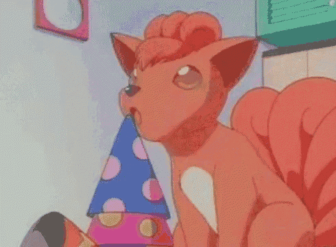 a cartoon fox wearing a party hat is sitting on a bed .
