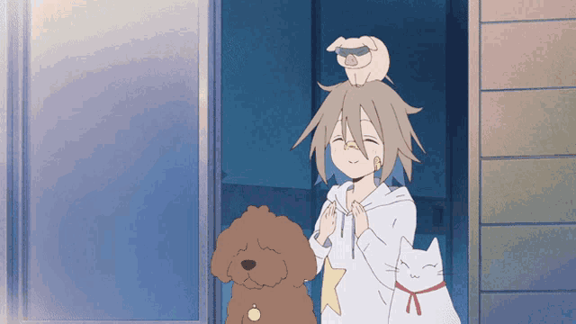 a girl with a dog and a cat standing in front of a door