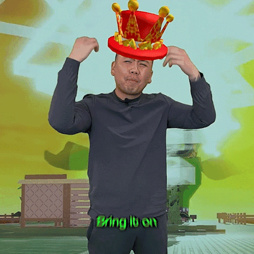 a man is wearing a red hat with a crown on it and the words bring it on behind him