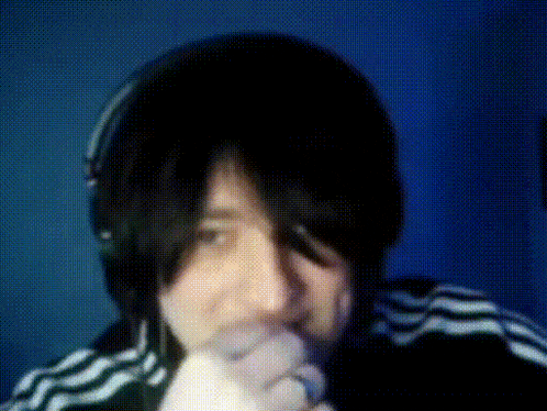 a person wearing headphones and a black and white striped jacket