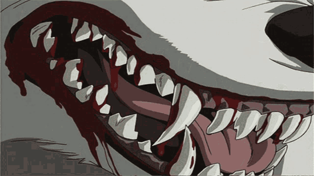 a close up of a wolf 's teeth with blood dripping from them