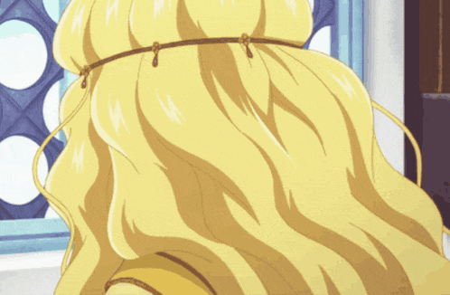 a close up of a woman 's blonde hair with a rope around it