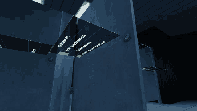 a dark room with a few signs on the wall one of which says ' uberfahrt '