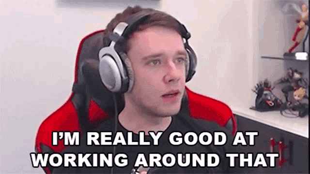 a man wearing headphones is sitting in a chair and saying `` i 'm really good at working around that ''