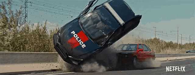 a police car is driving down a highway
