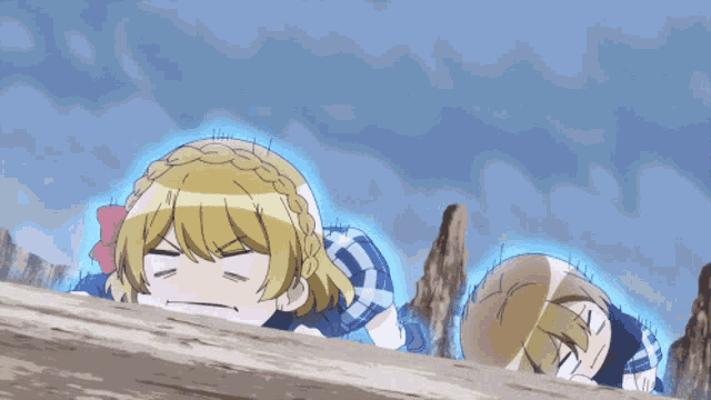 a couple of anime characters laying on the ground with a blue glow around them