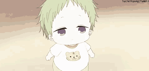 a baby wearing a white shirt with a cat on it .