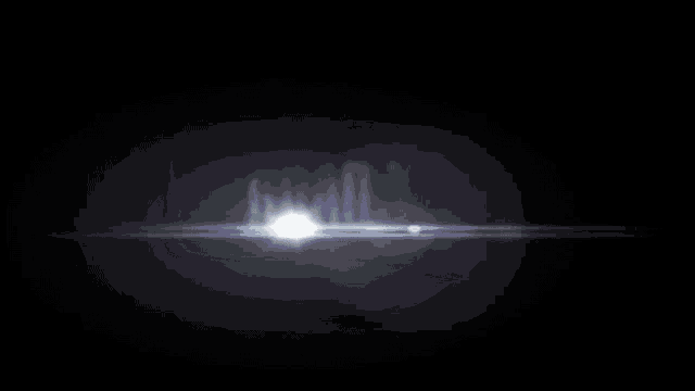 a white light is shining through a dark window