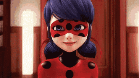 a close up of a ladybug cartoon character wearing a red mask and smiling .