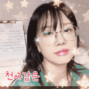 a woman wearing glasses is standing in front of a sheet of music