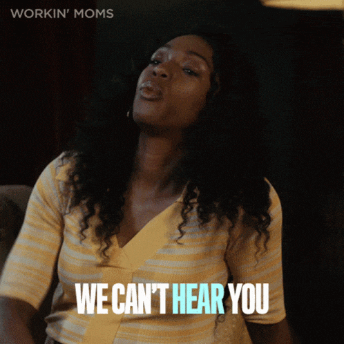 a woman sitting on a couch with the words " we can 't hear you " written below her