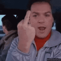 a man in a car is giving the middle finger .