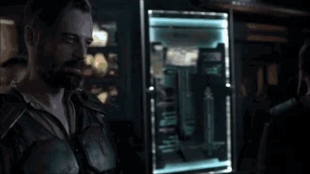 a man with a beard is standing in front of a vending machine that says ' i 'm not ' on it