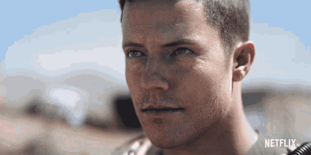 a close up of a man 's face with the word netflix on the bottom right
