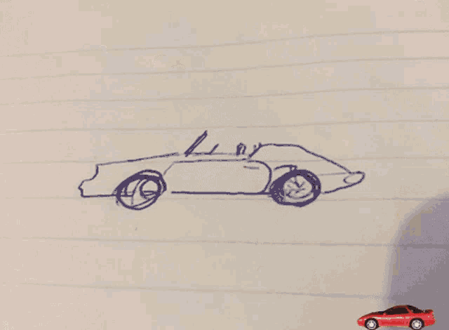 a piece of paper with ketchup on it and a red car