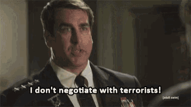 a man in a suit and tie says " i don t negotiate with terrorists "