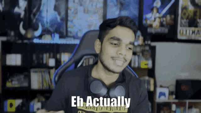 a man wearing headphones and a shirt that says eh actually on it