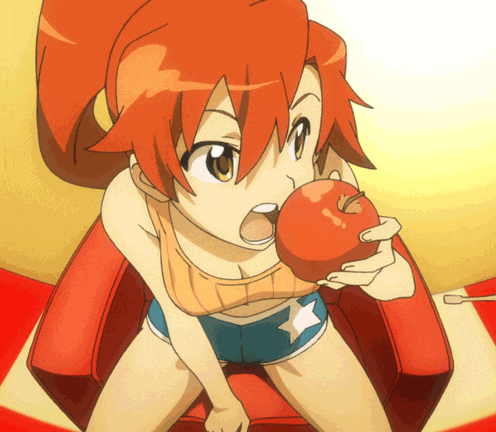 a girl with red hair is sitting on a red chair eating an apple