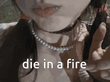 a close up of a woman 's face with the words die in a fire