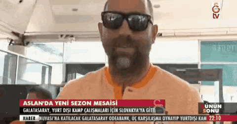 a man wearing sunglasses is on a tv screen