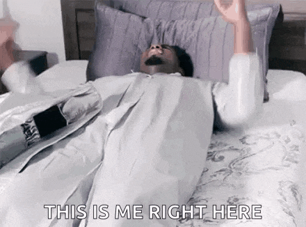 a man is laying on a bed with his arms outstretched and the words `` this is me right here '' written on it .