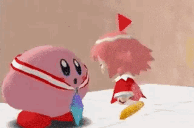 kirby and amy are standing next to each other in a video game and talking to each other .