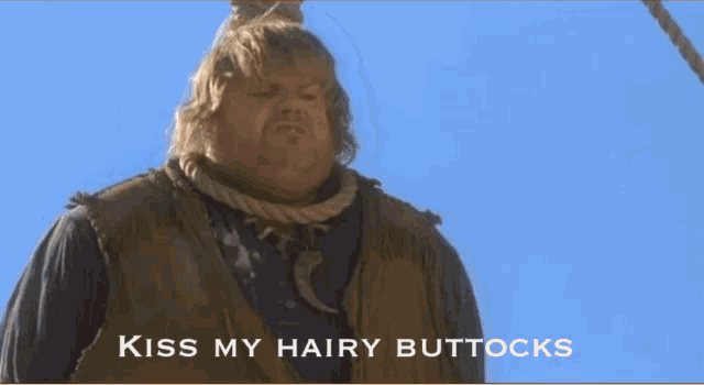 a man with a rope around his neck and the words kiss my hairy buttocks below him