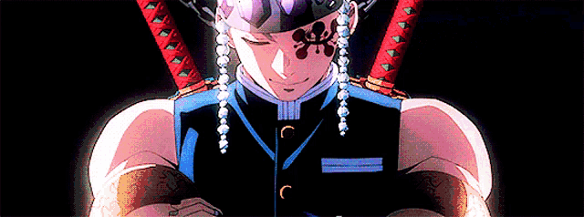 a close up of a person holding two swords in their hands .