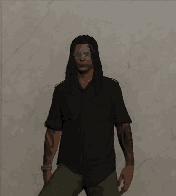 a man wearing sunglasses and a black shirt