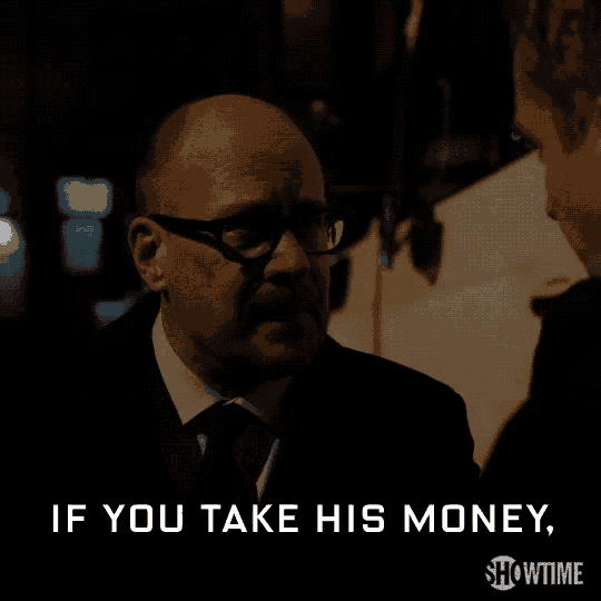 a man in a suit and tie is talking to another man and says if you take his money showtime