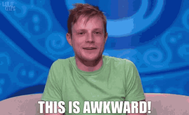 a man in a green shirt is sitting on a couch and says " this is awkward "