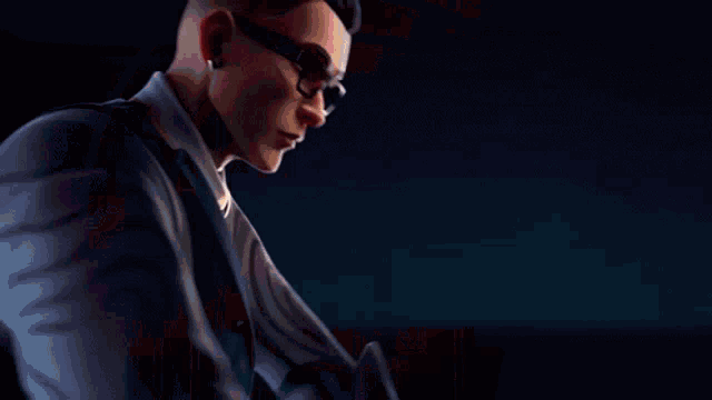 a man wearing glasses is holding a glowing object in his hands .