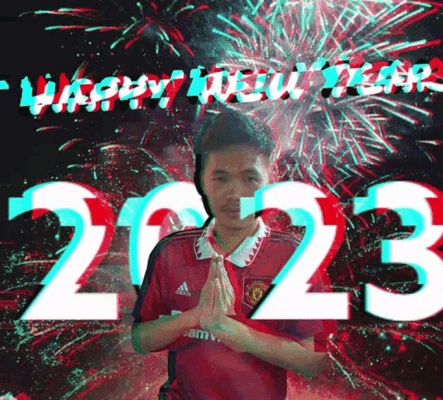 a man in a red adidas jersey stands in front of a fireworks display that says happy new year