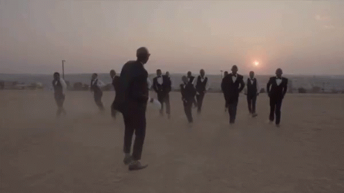 Dancing In Suits In The Dust GIF - Sons Of Kemet Dust Kick GIFs