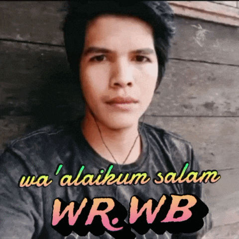 a man wearing a black shirt with the words wa ' alaikum salam wrwb on it