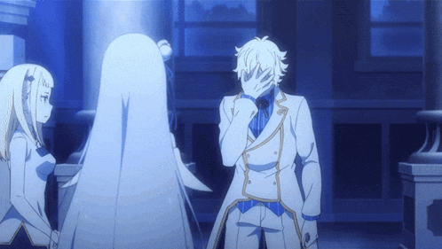 a man in a white suit is covering his face with his hands