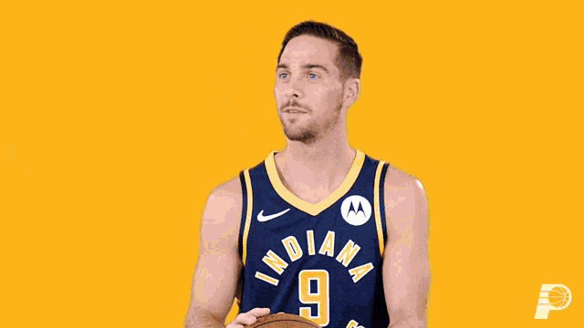 a basketball player for the indiana pacers is holding a basketball